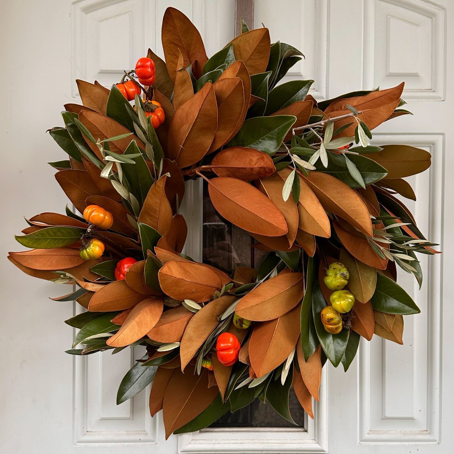 Fresh handmade magnolia olive and pumpkin tree wreath for fall autumn and Thanksgiving decor