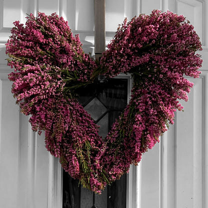 Hot Pink Erica Heather Heart Wreath Hung on A White Door